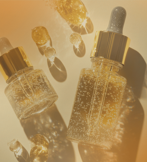Two bottles of skincare oil with light reflecting the surface