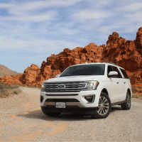Car parked in a rocky mountains scene